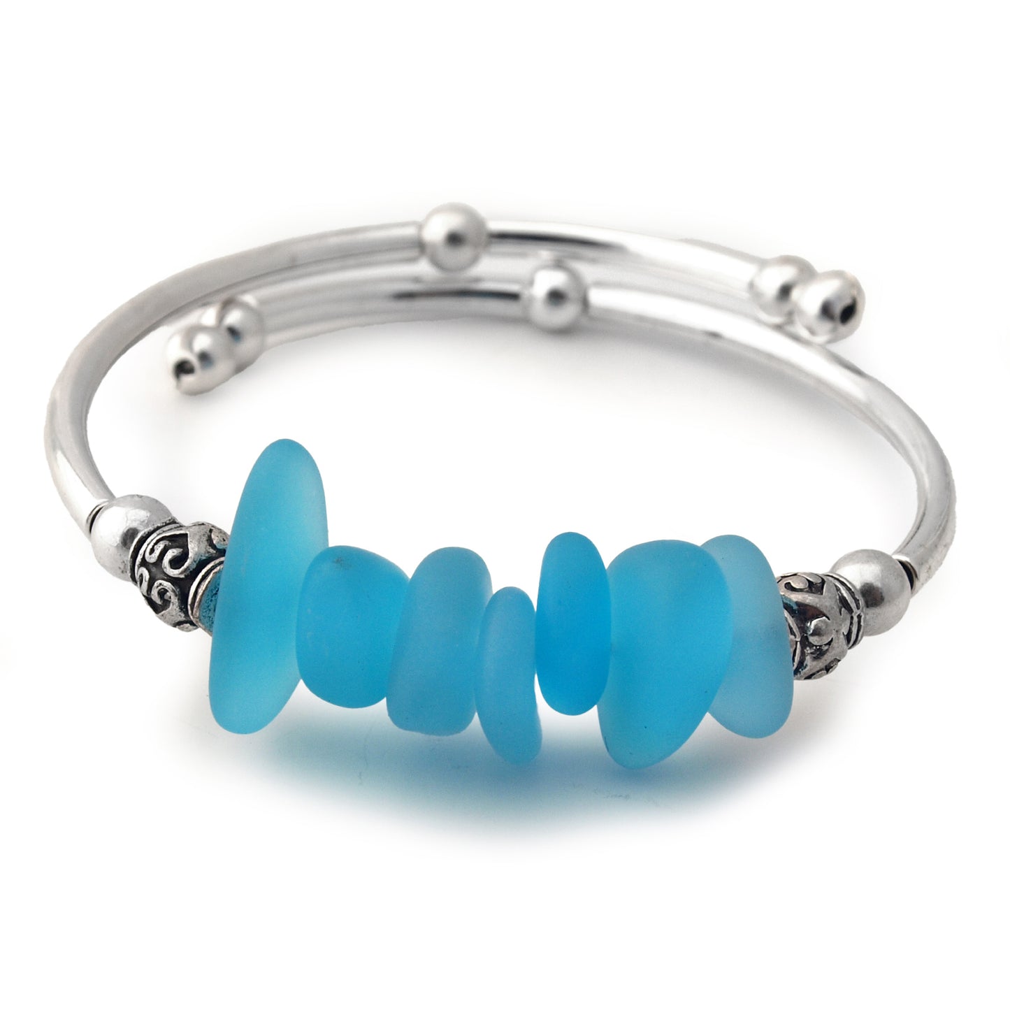 Silver bracelet with blue beads on a white background