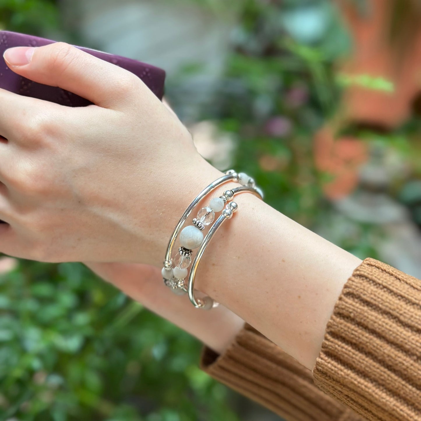 Silver bracelet with white marble on wrist