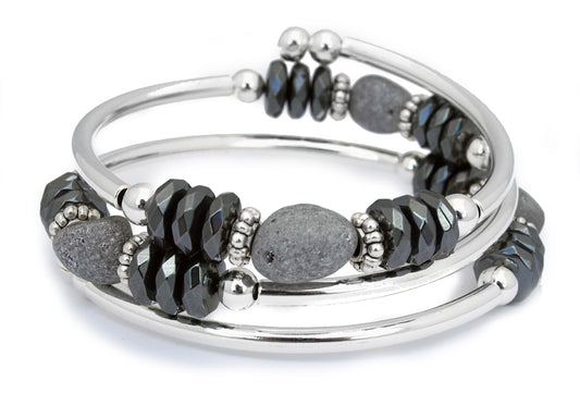 gray electroplated rough druzy stone with 3 faceted hemalyke rondelles on either side, repeated 4 times on a memory wire bracelet.