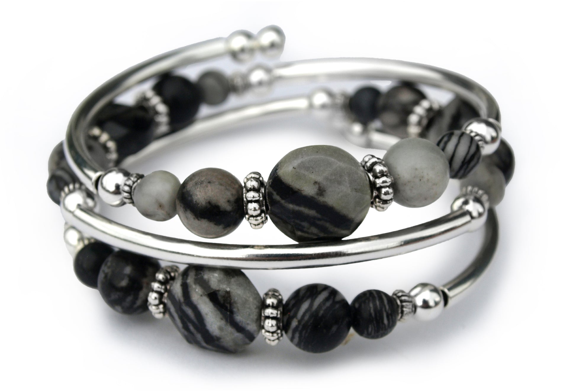Gray and black beaded bracelet on a white background 