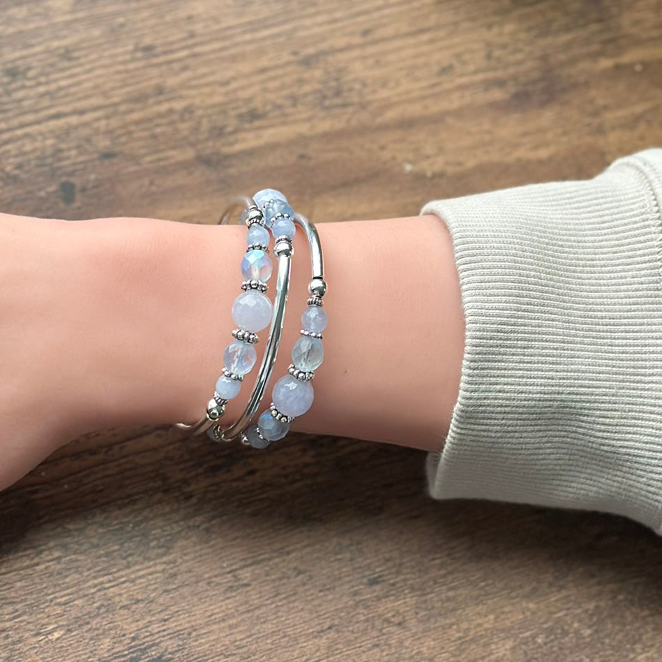 Blue beaded bracelet on wrist 