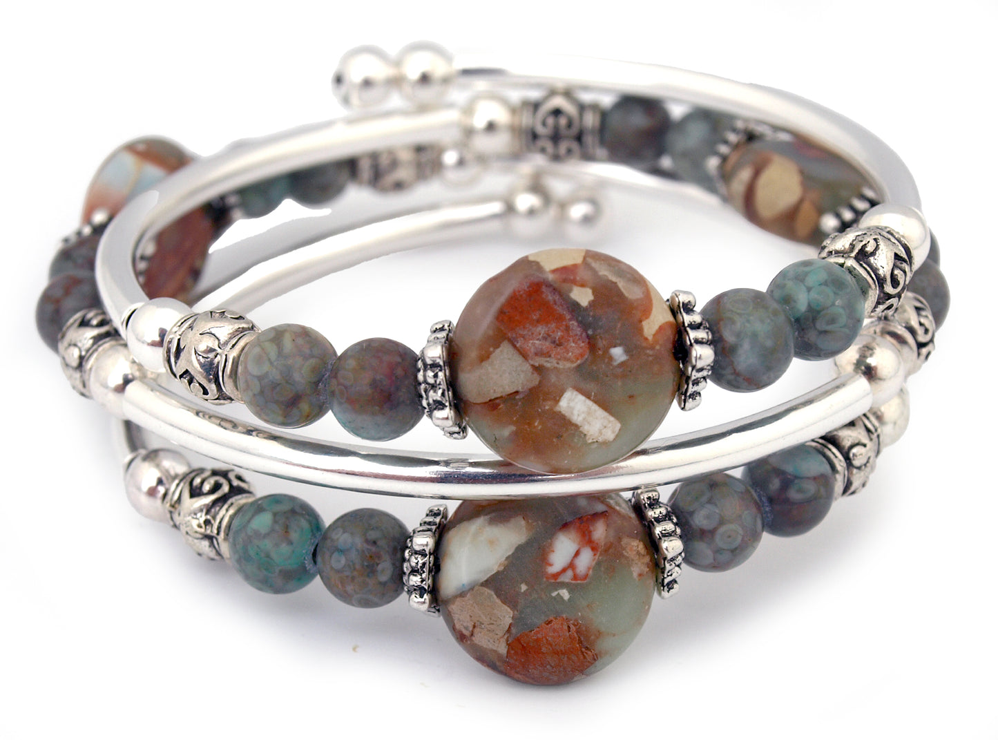 Blue and Brown beads on a silver bracelet on white background