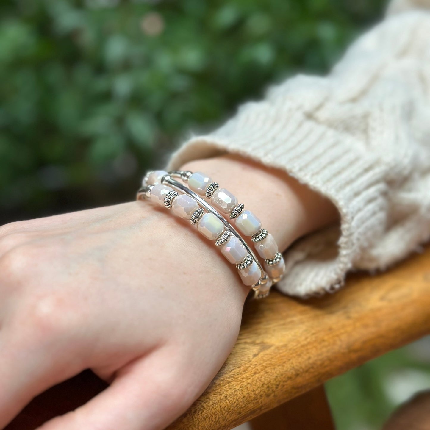 Pink beaded bracelet on a wrist