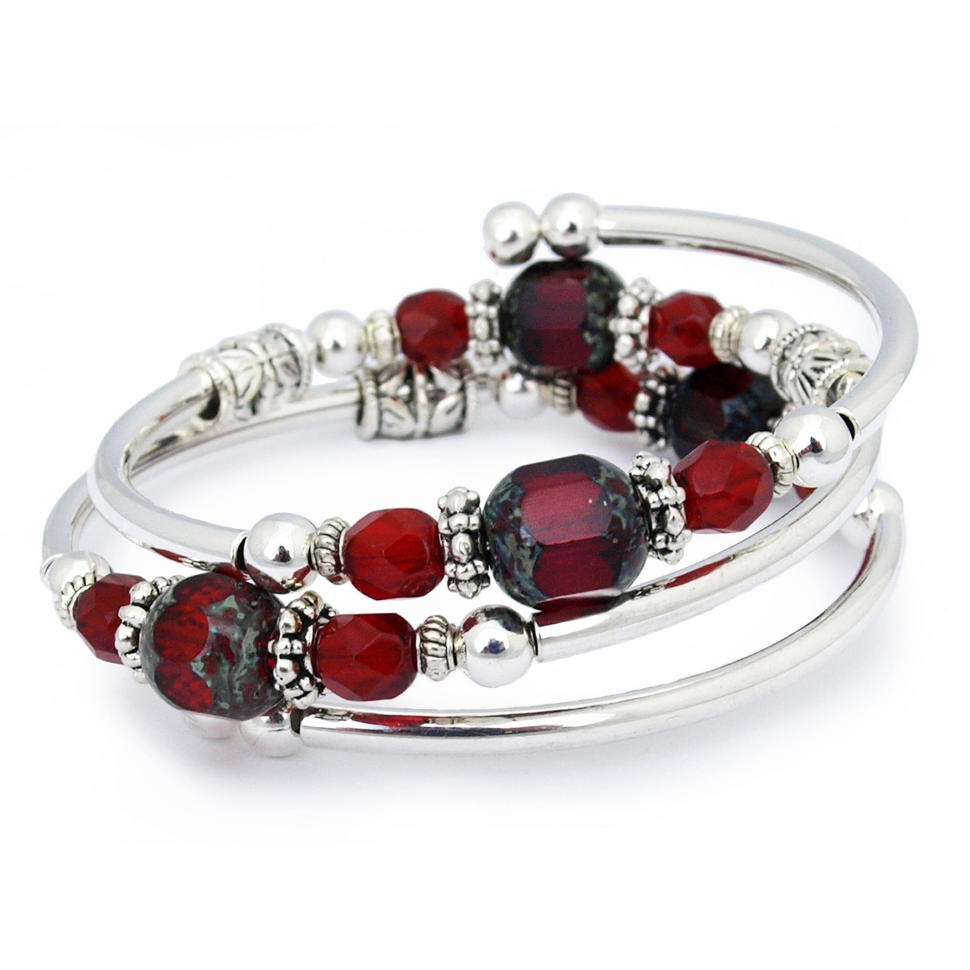 Silver bracelet with deep red faceted glass beads on a white background