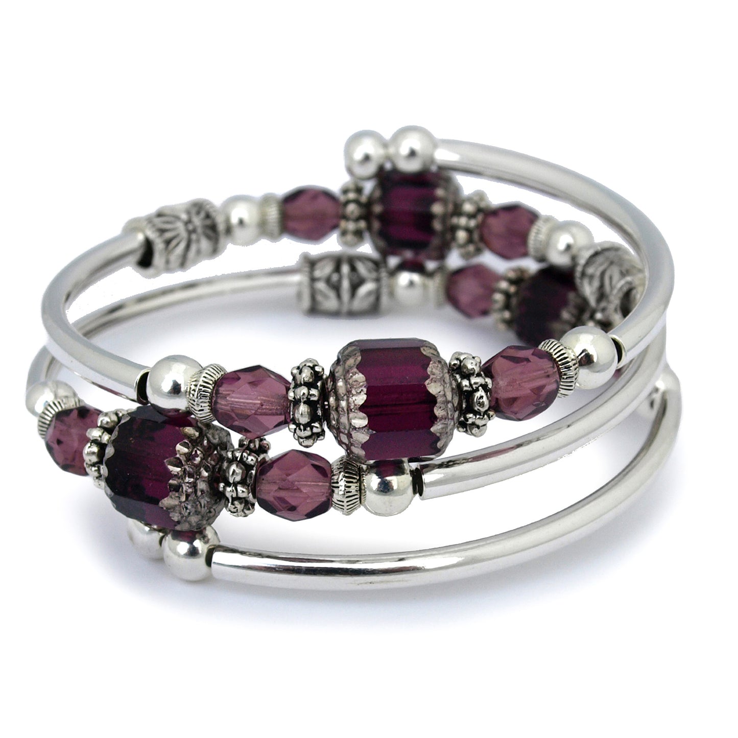 Silver bracelet with faceted purple glass beads on a white background