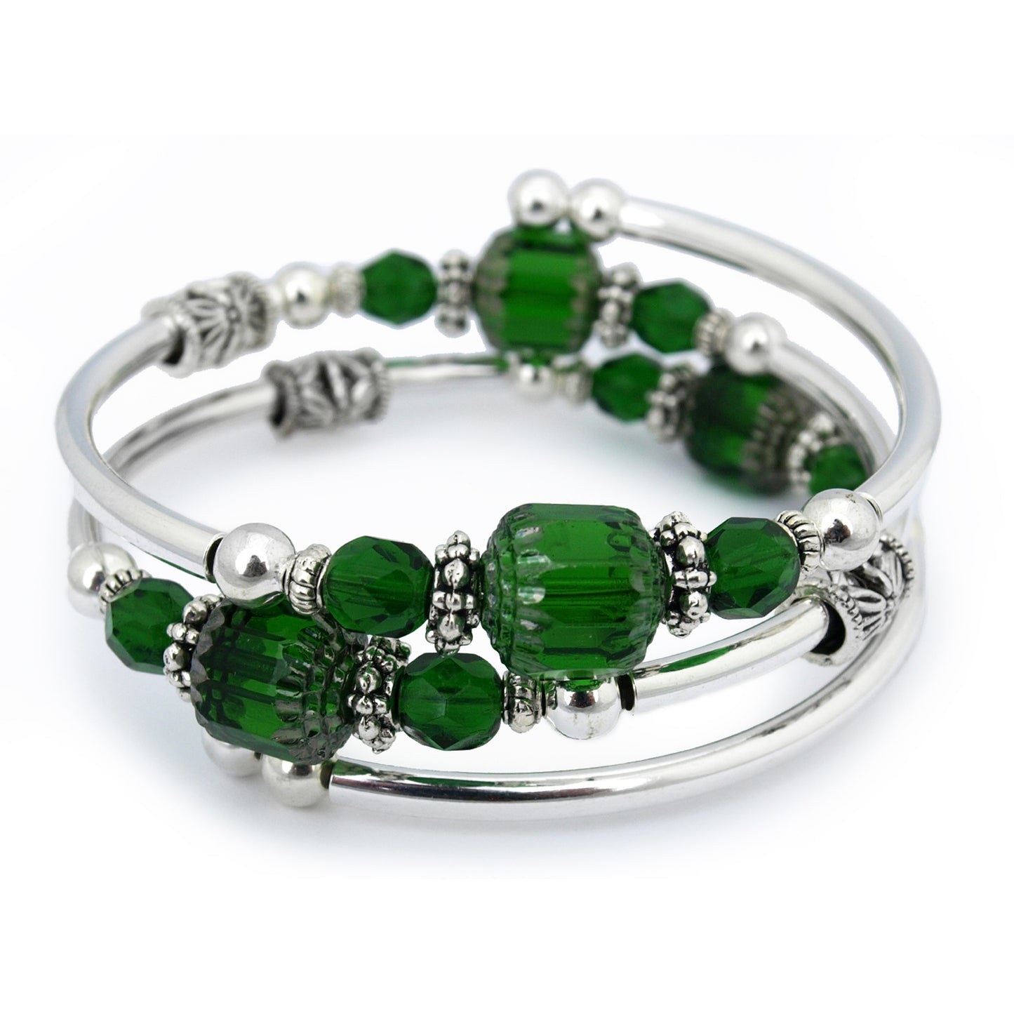 Silver bracelet with green beads on a white background