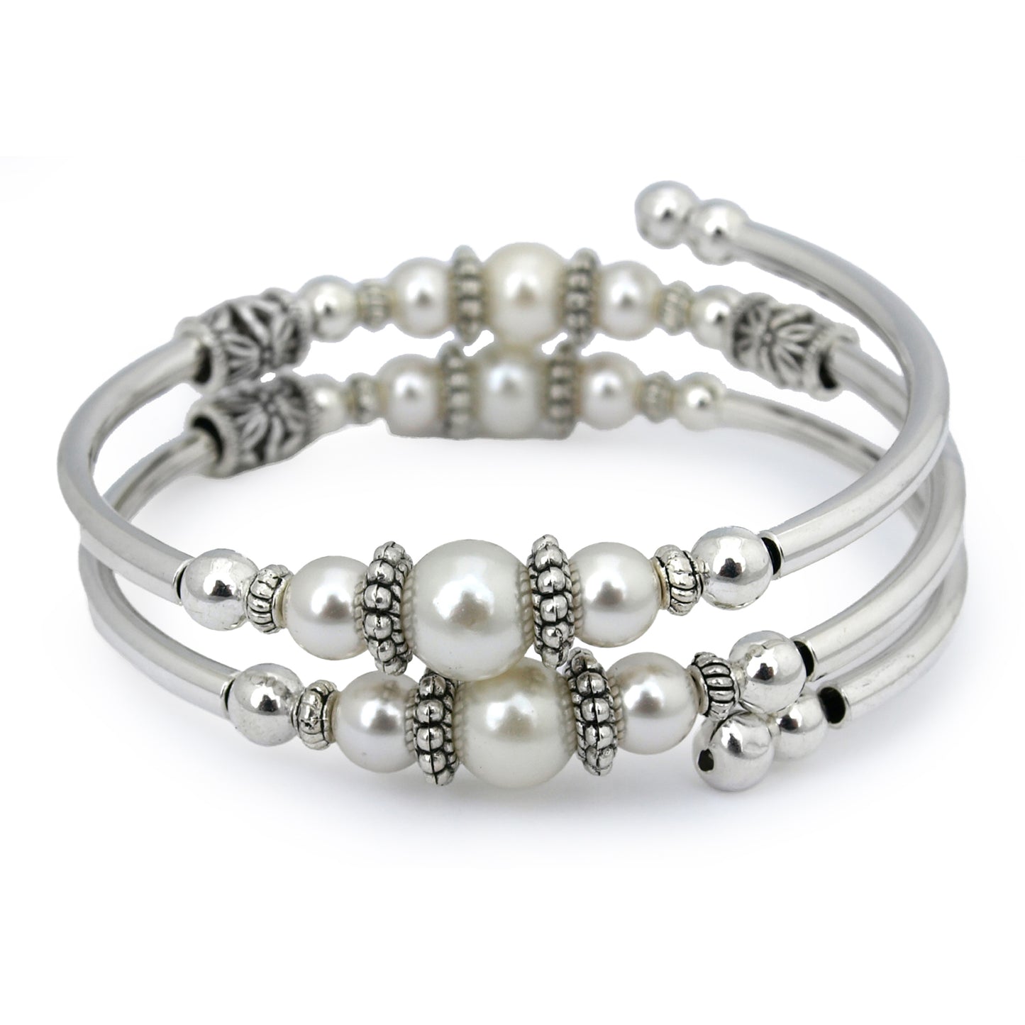 Silver bracelet with white pearls on a white background