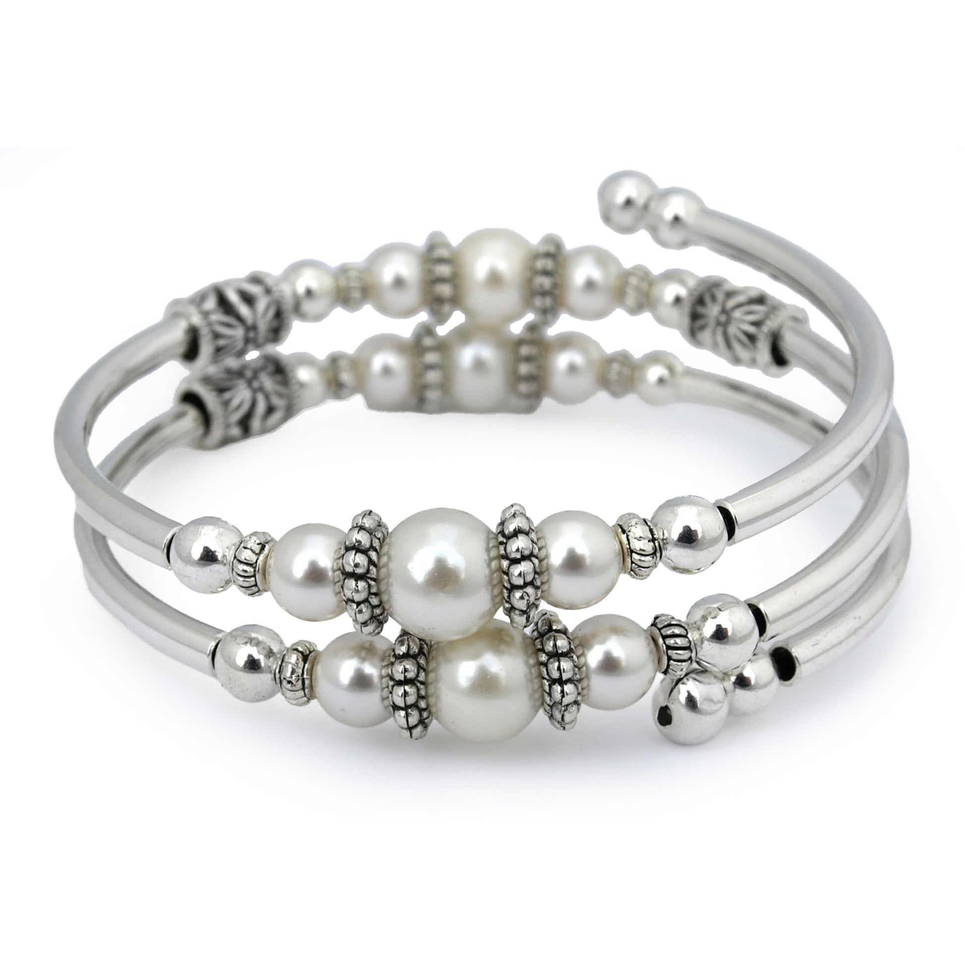 Silver bracelet with white pearls on a white background