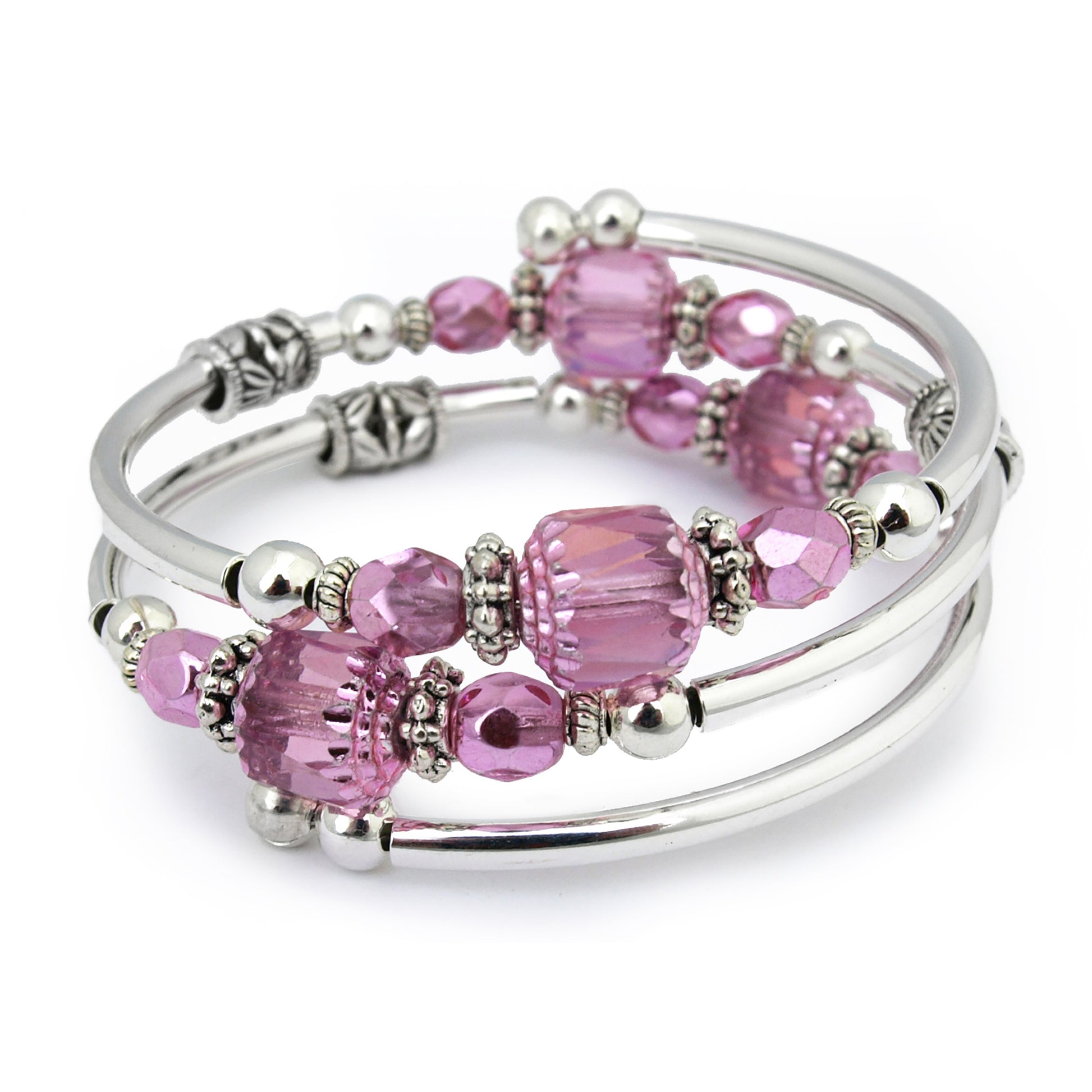 Silver bracelet with pink faceted beads on a white bacground