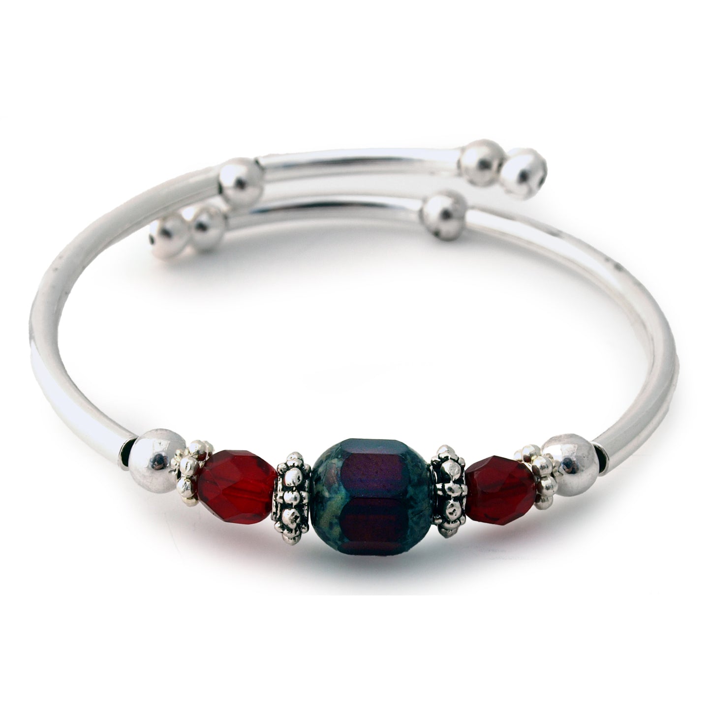 Silver bracelet with deep red beads on a white background