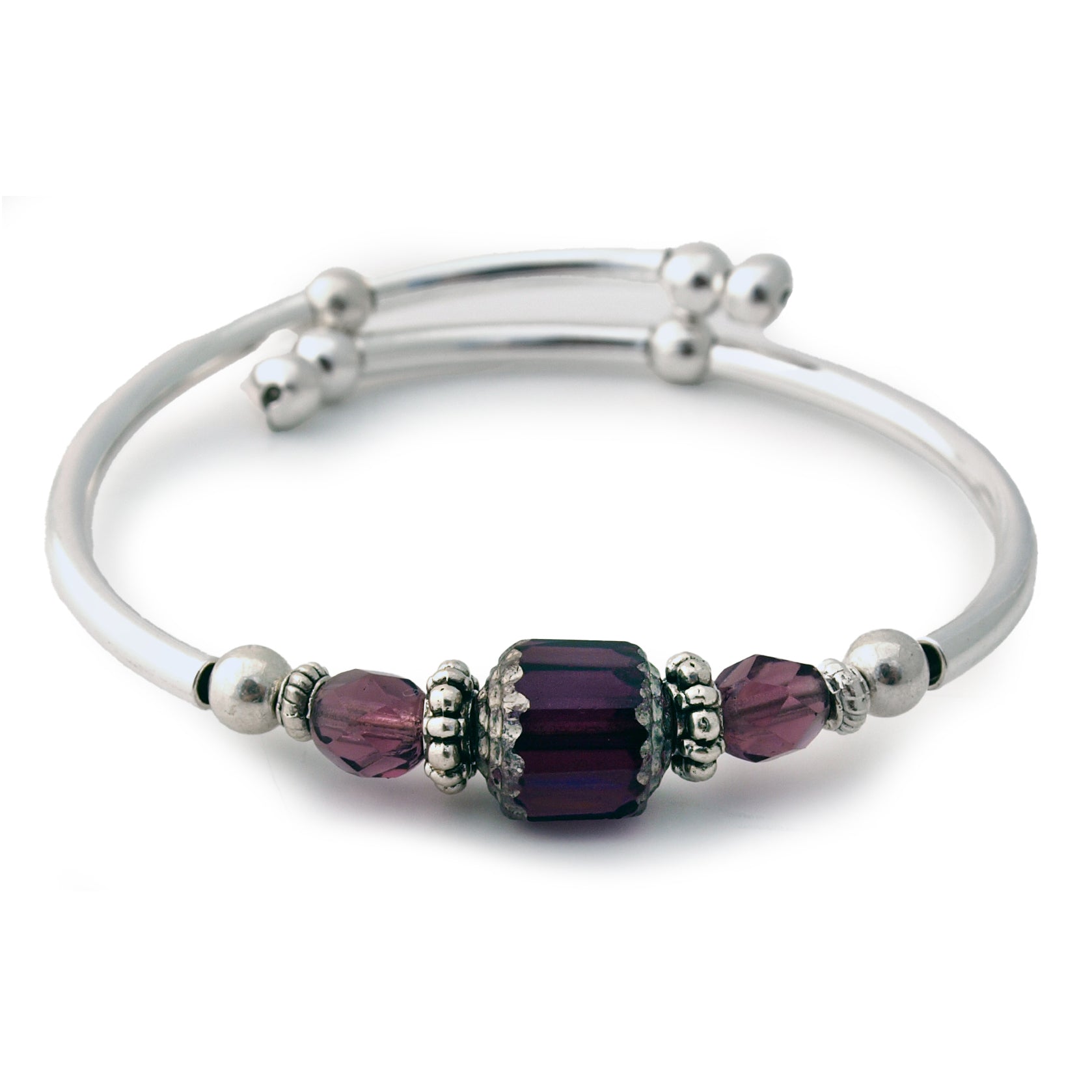 Silver bracelet with purple beads on a white background