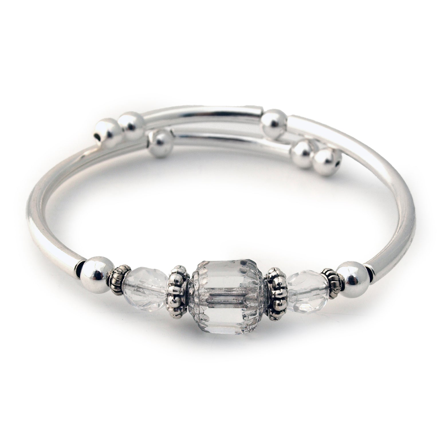 Silver bracelet with clear bead on a white background