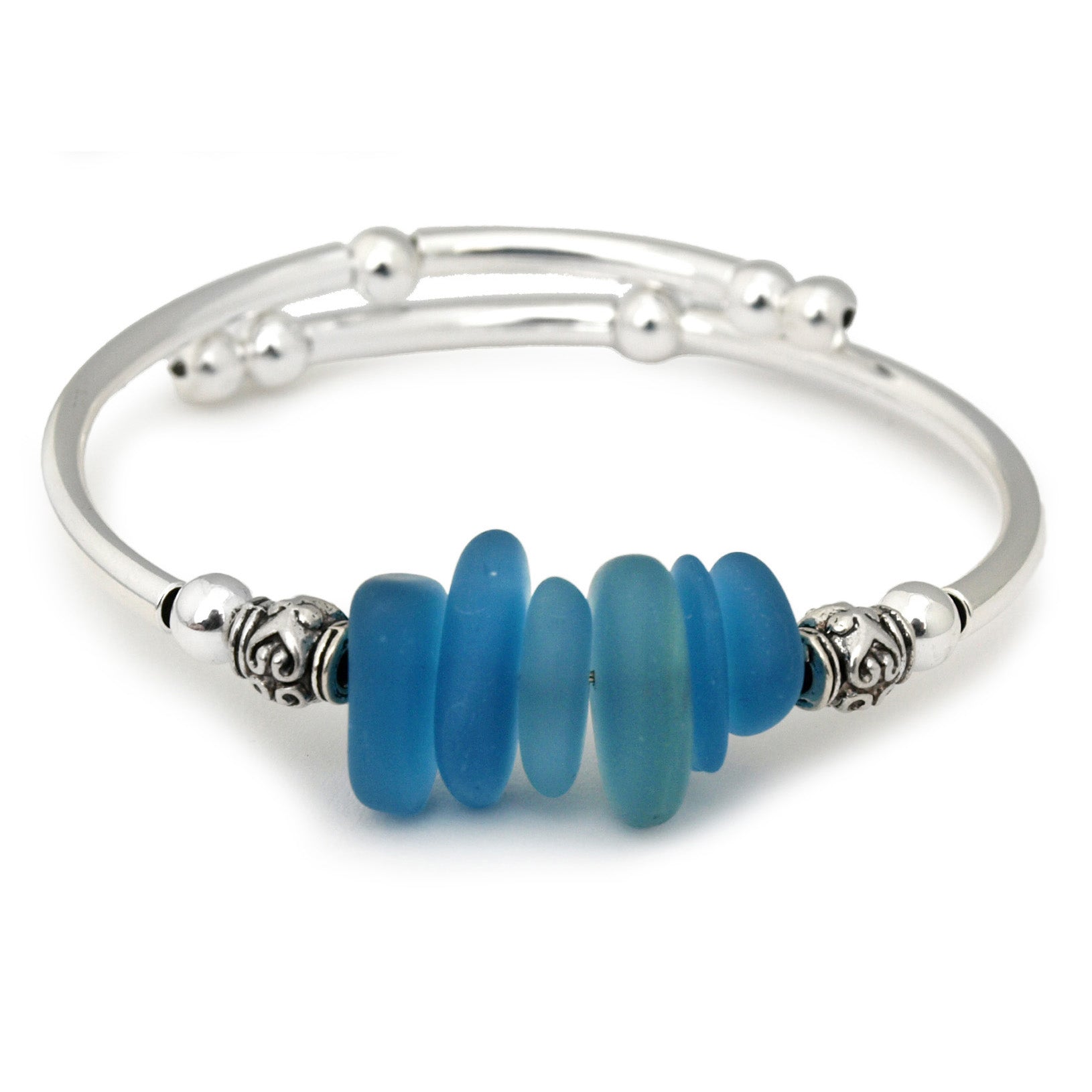 Silver bracelet with blue beads on a white background