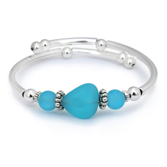 Silver bracelet with turquoise beads on a white background