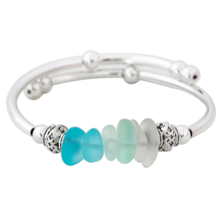Silver bracelet with turquoise and white beads on a white background