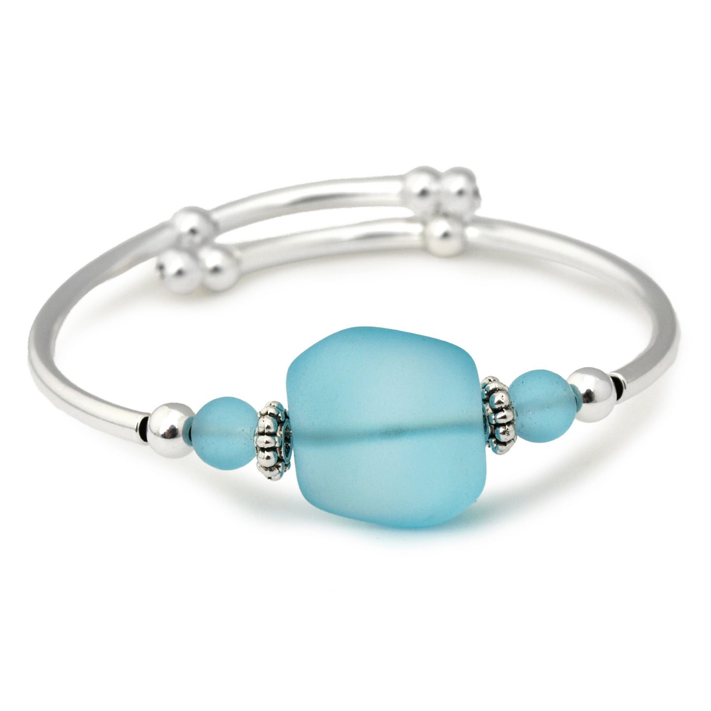 Silver bracelet with frosted aqua blue sea glass bead on a white background