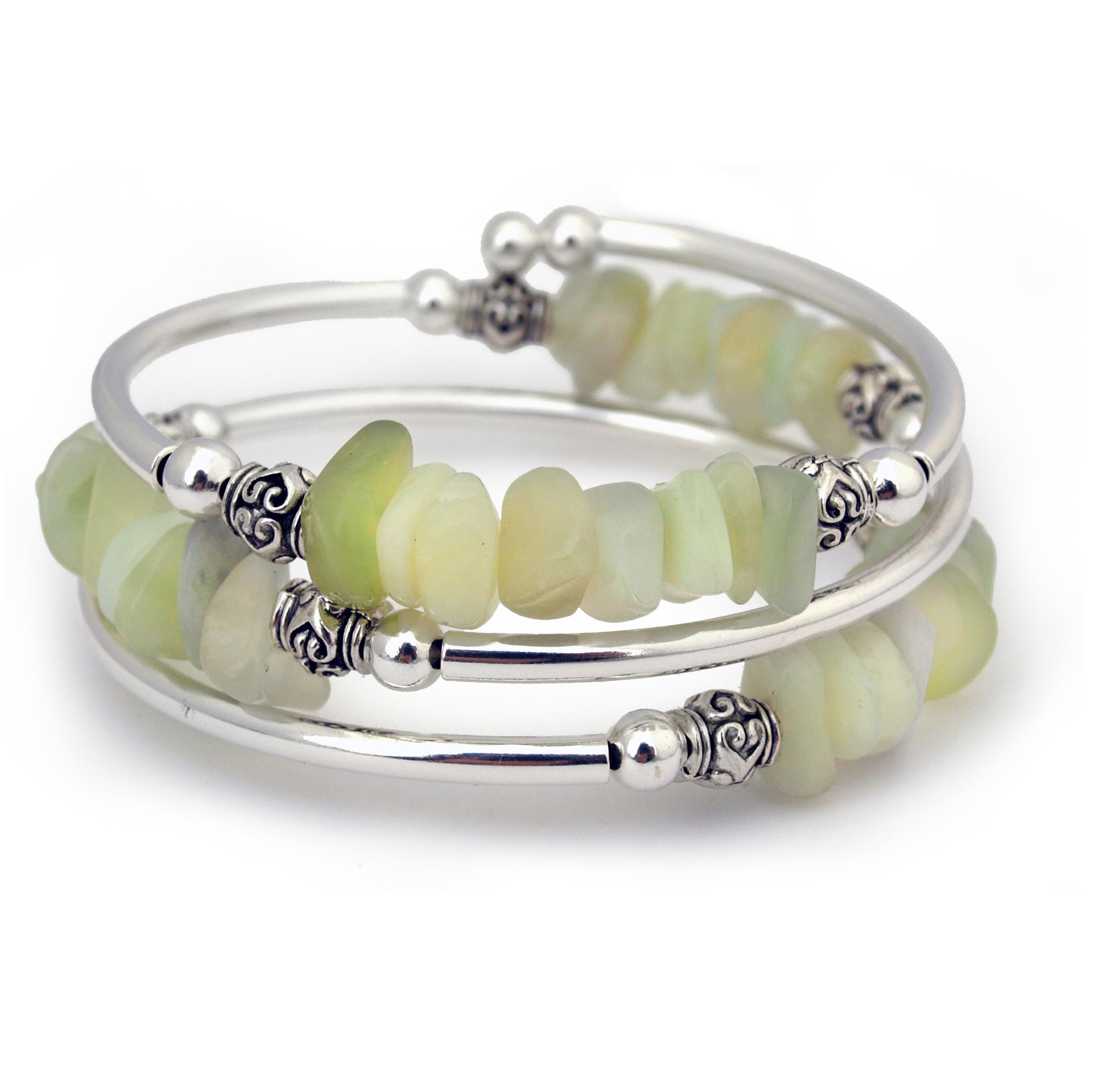 Silver bracelet with light green stone pebbles on white background