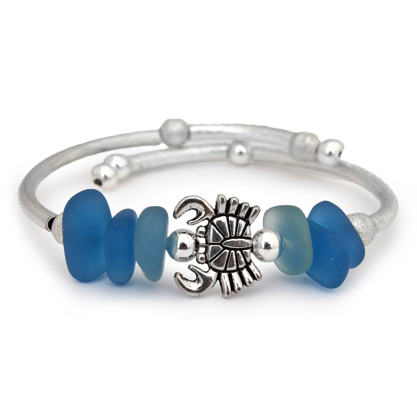Silver bracelet with blue beads and a crab charm on a white background