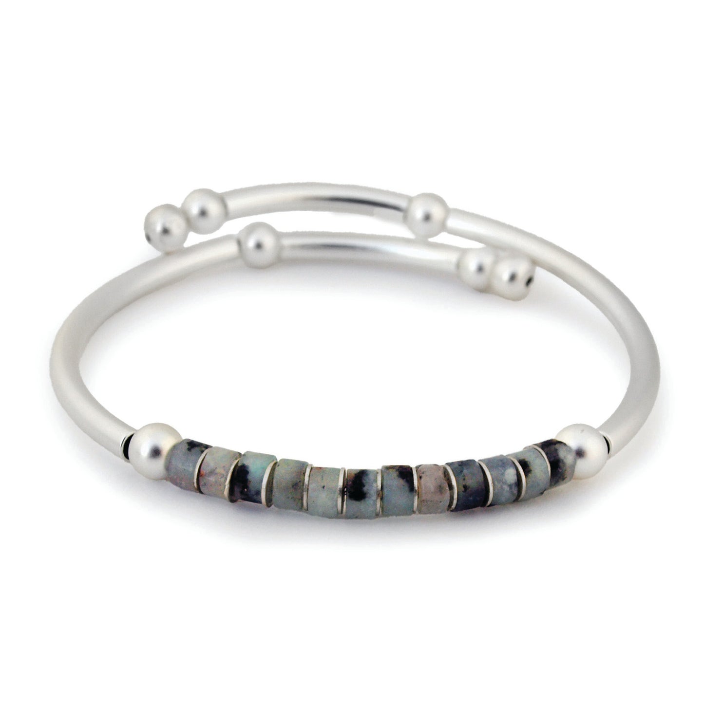 Silver bracelet with embedded stones on a white background