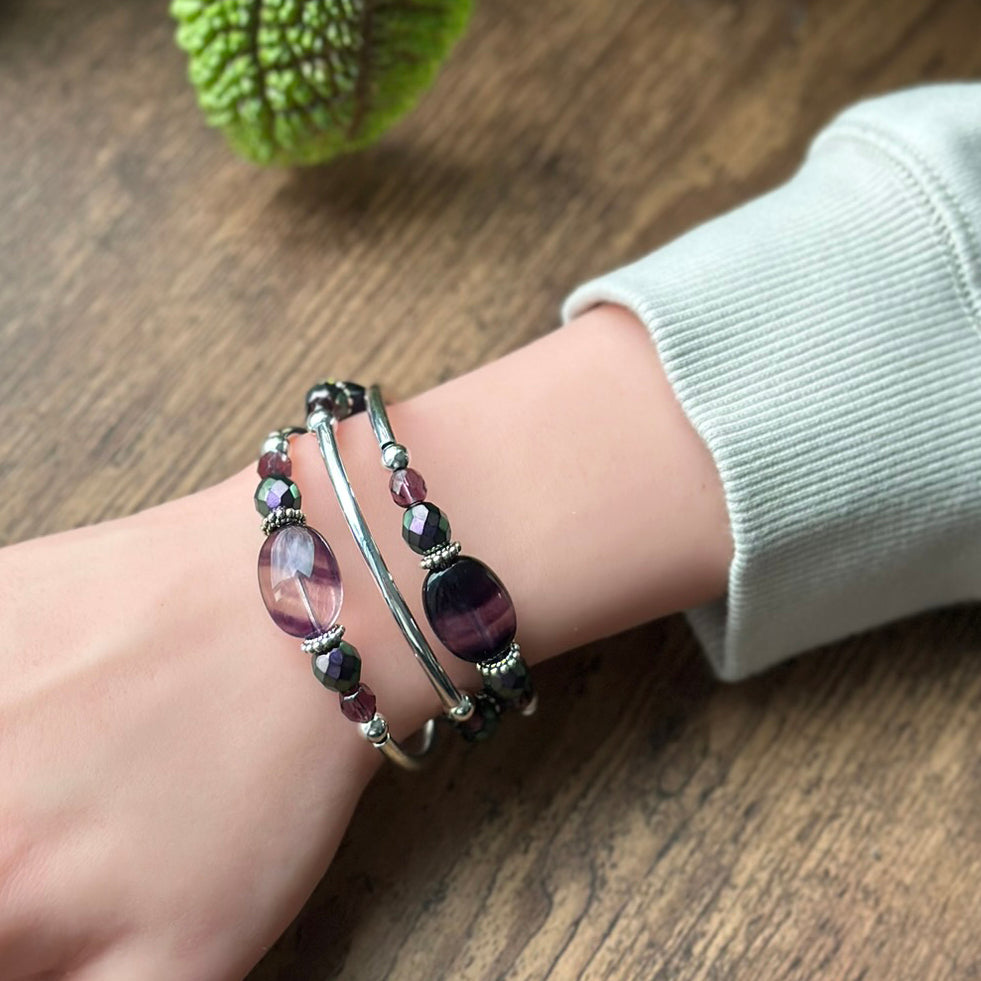 Beaded bracelet on a wrist with a wooden background