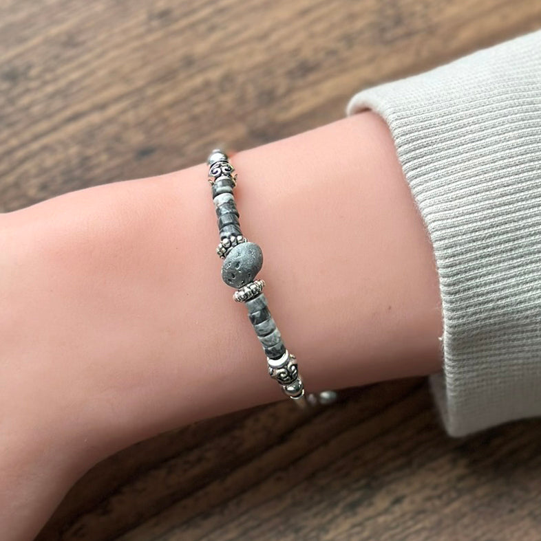 gray stone bracelet on a wrist