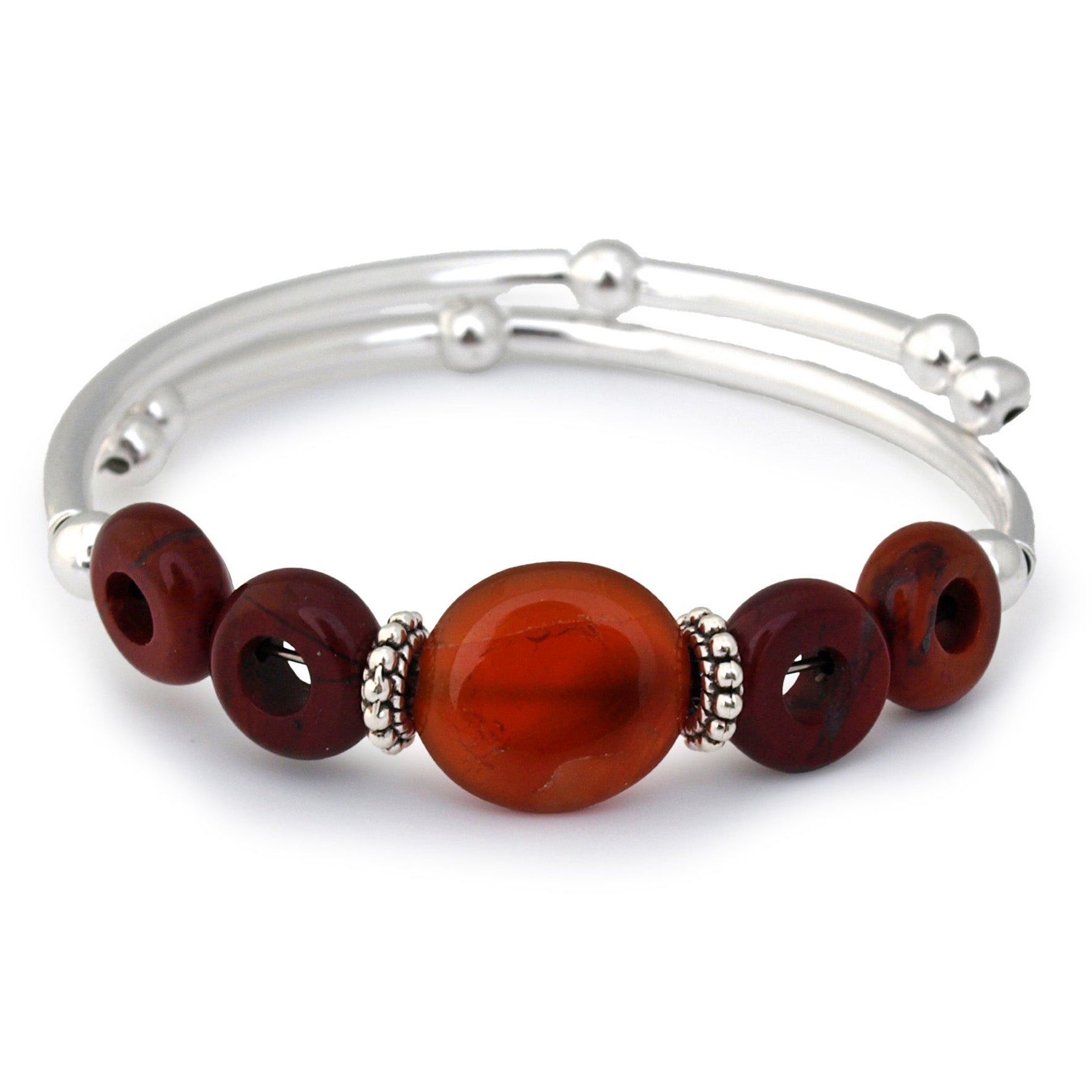 Silver bracelet with red beads on a white background