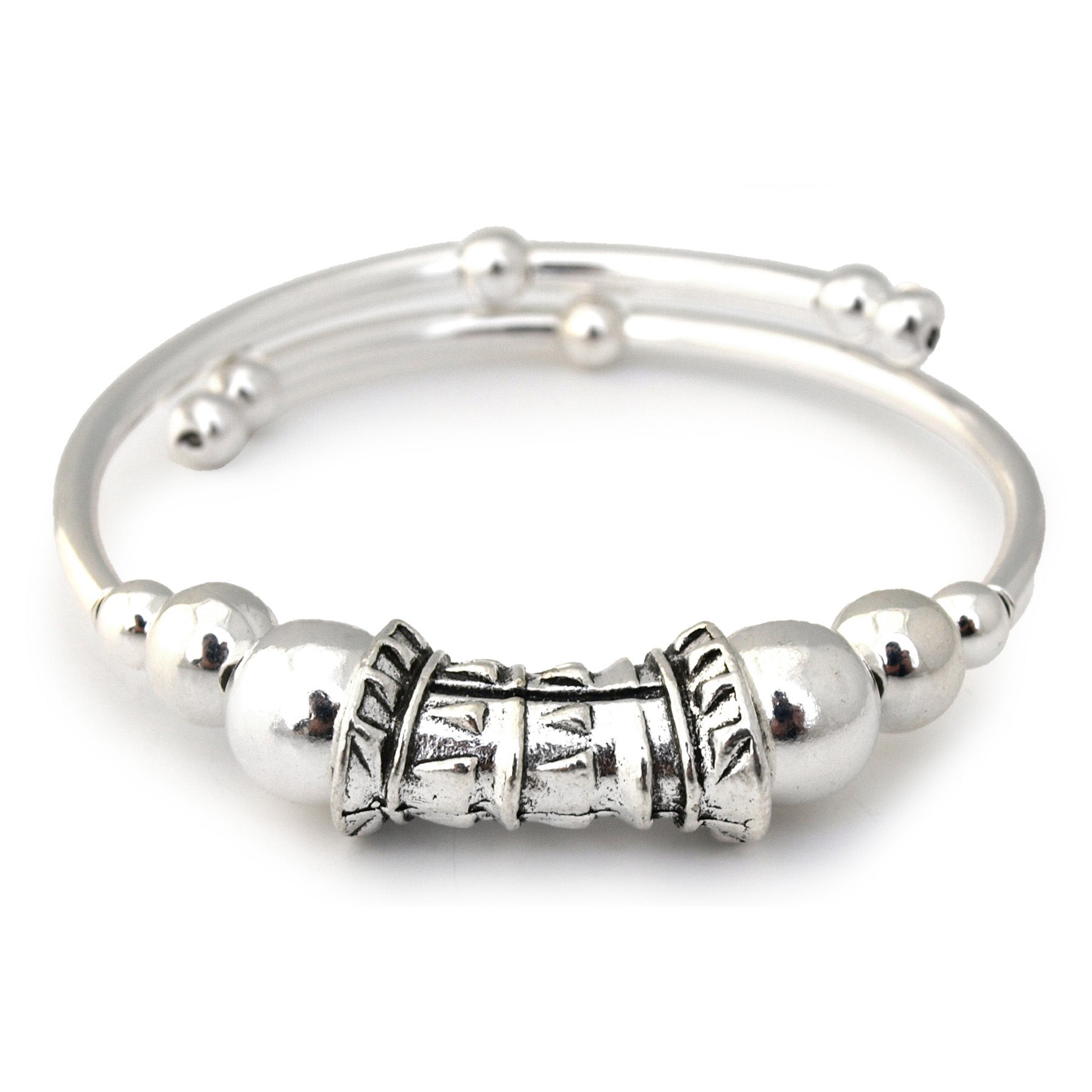 Silver bracelet with decorative beads on a white background