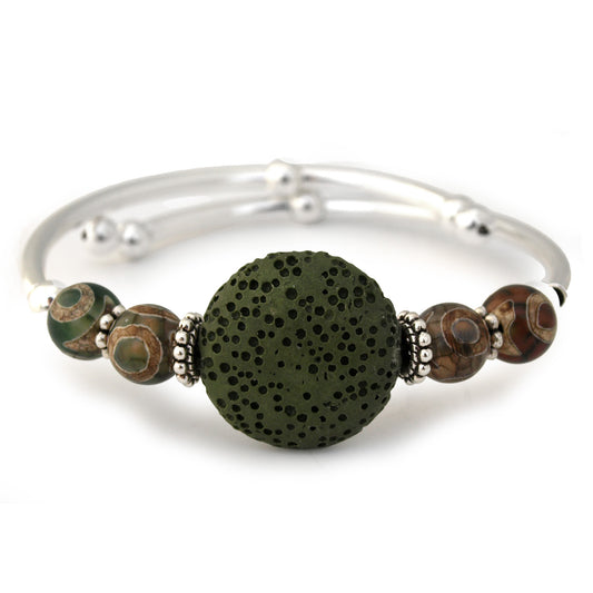 Silver bracelet with a large green bead and smaller brown beads on a white background