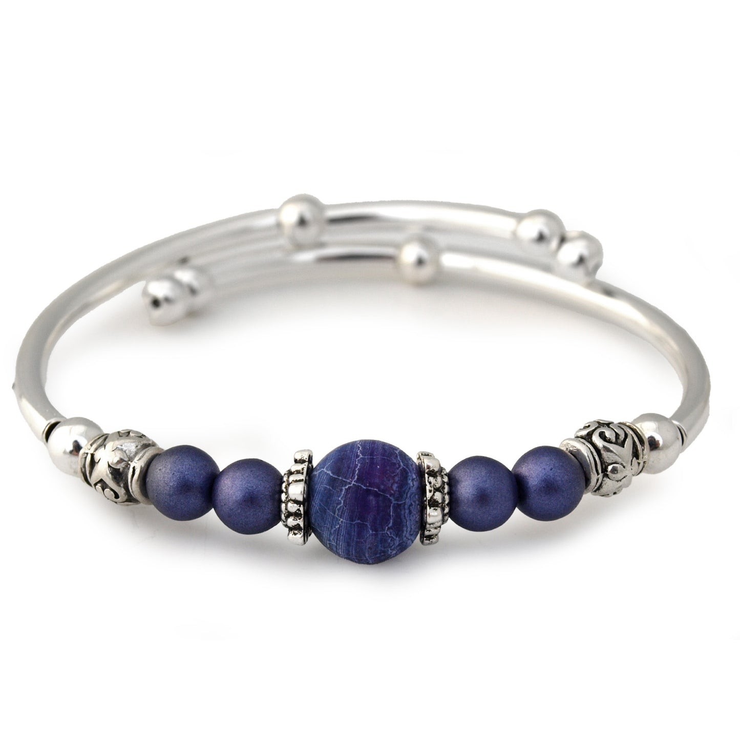 Silver bracelet with purple beads on a white background