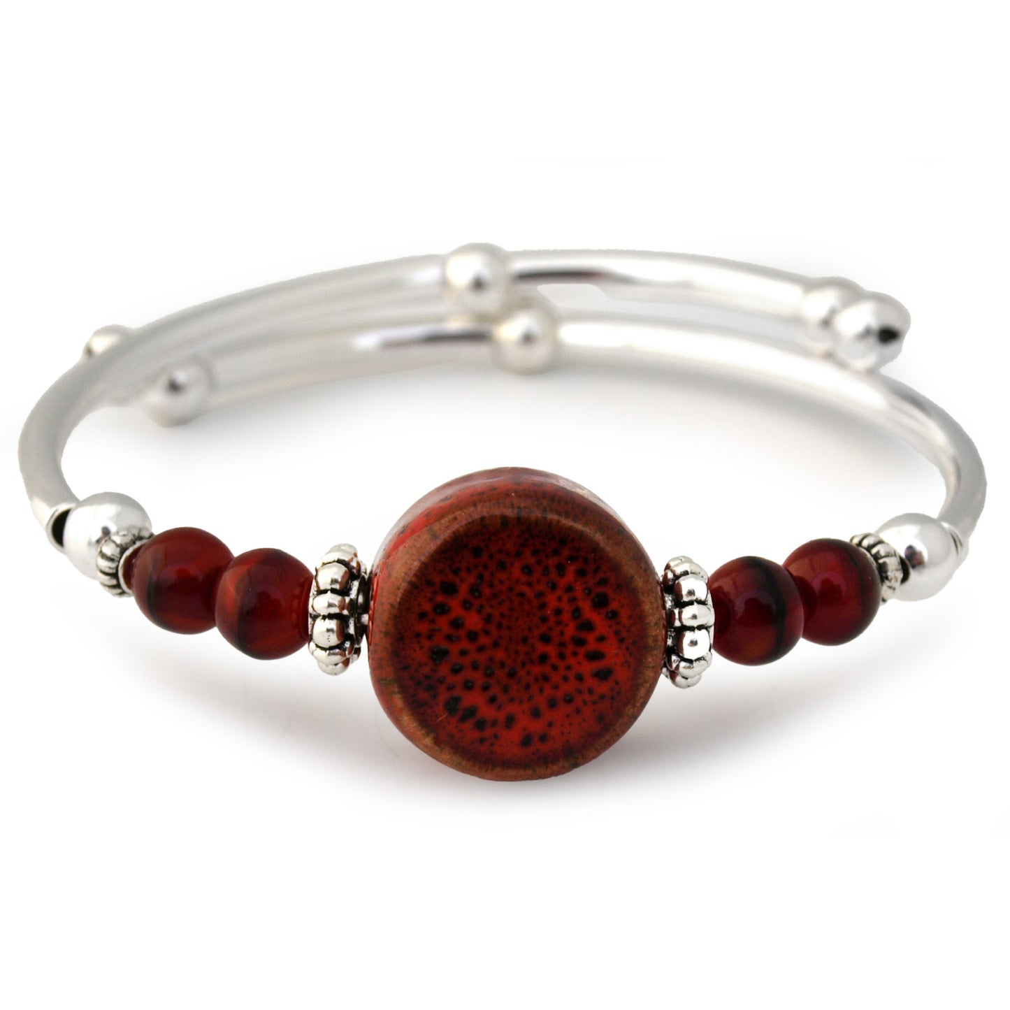Silver bracelet with a large brown bead and smaller red beads on a white background