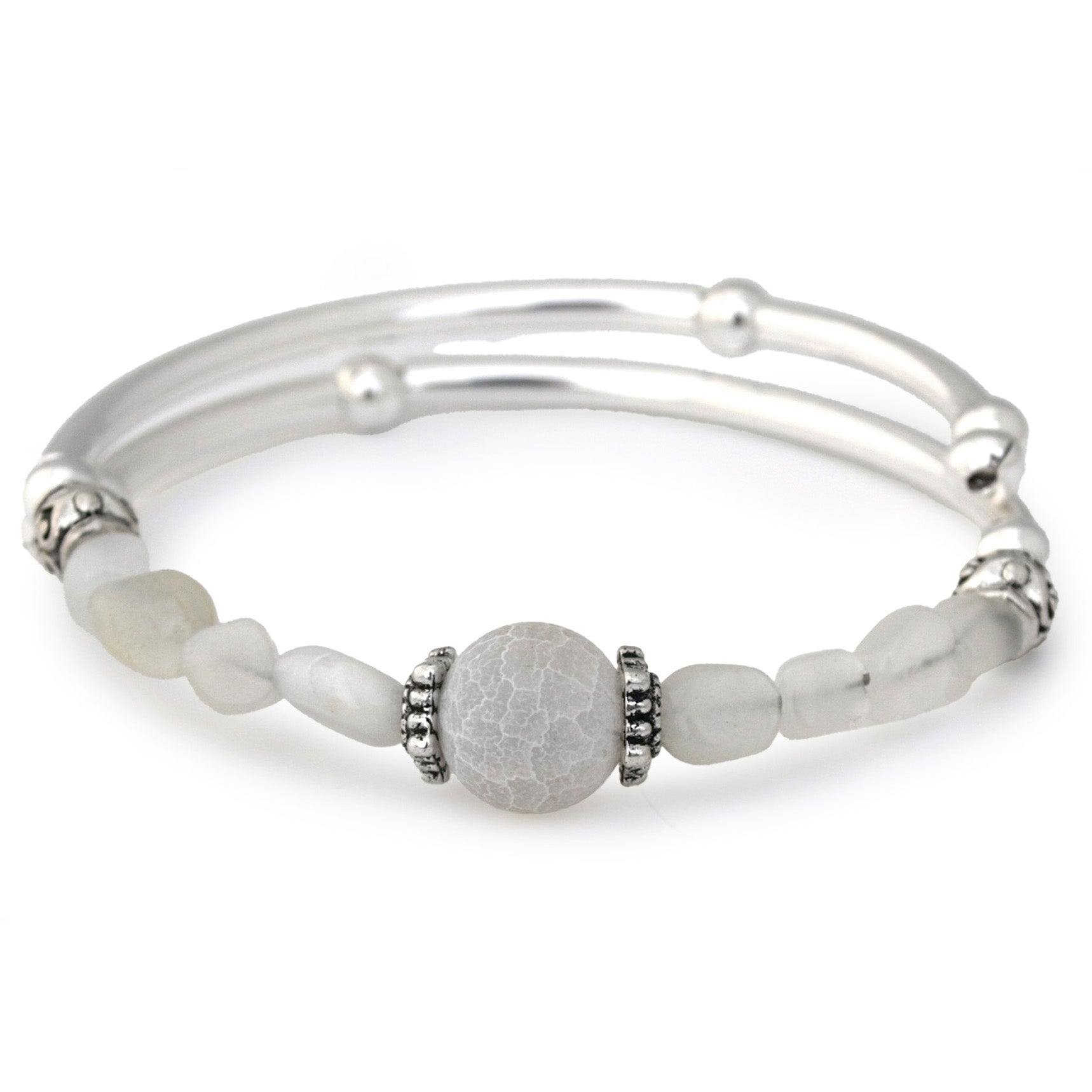 Silver bracelet with white beads on a white background