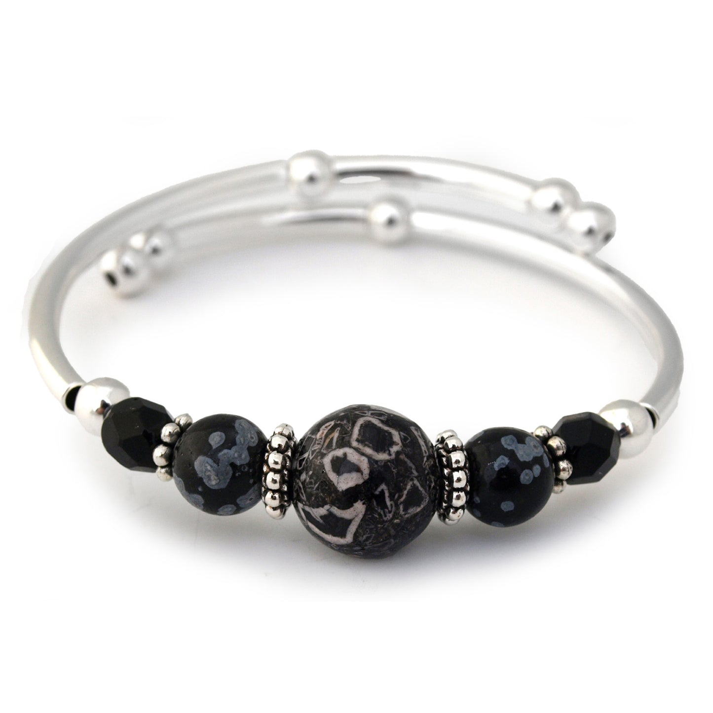 Silver bracelet with black beaded accents on a white background